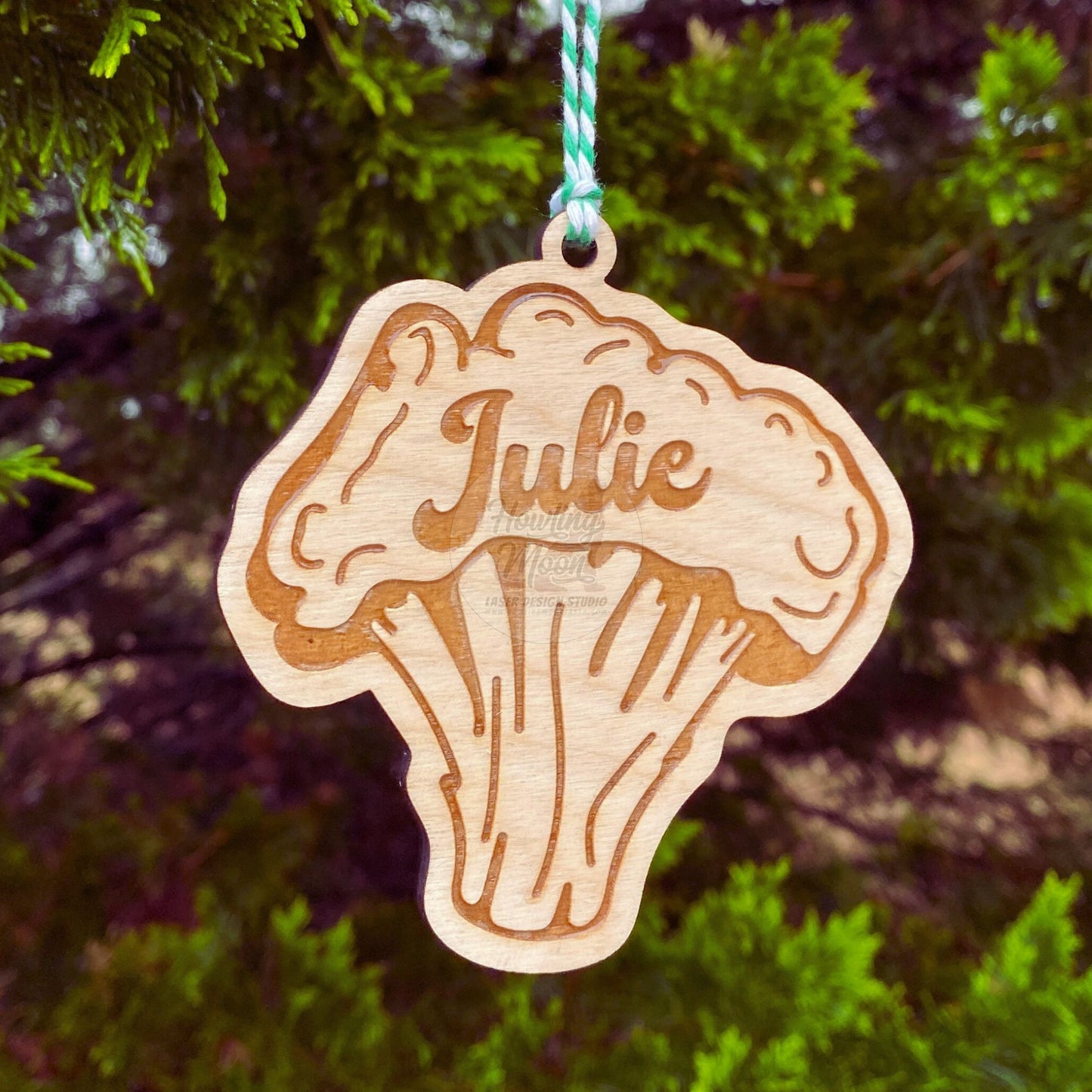 Personalized broccoli ornament made of natural wood hanging from a tree - made by Howling Moon Laser Design Studio in Virginia, USA