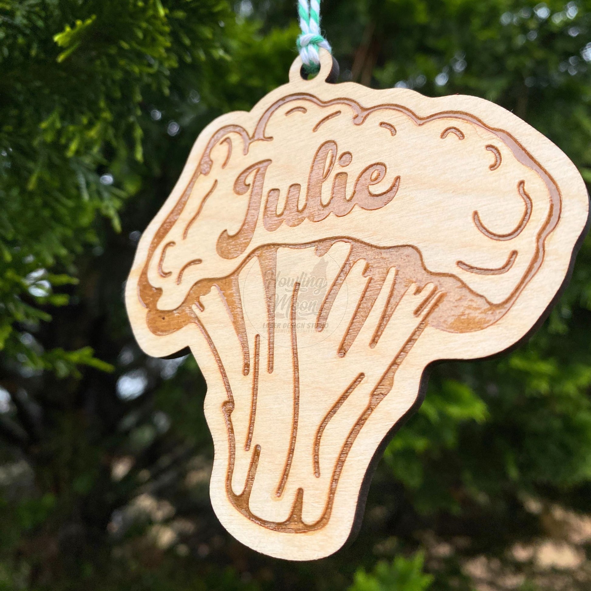 Right side view of Personalized broccoli ornament made of natural wood hanging from a tree - made by Howling Moon Laser Design Studio in Virginia, USA