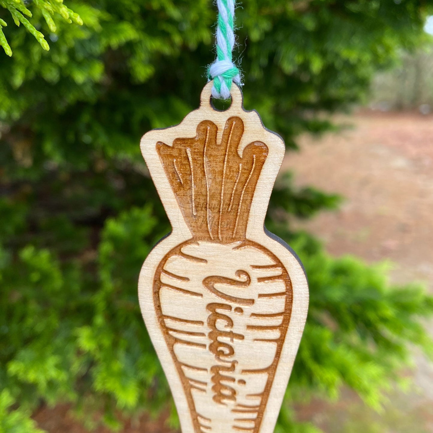 Close up of Personalized carrot ornament from Howling Moon Laser Design in Virginia USA.