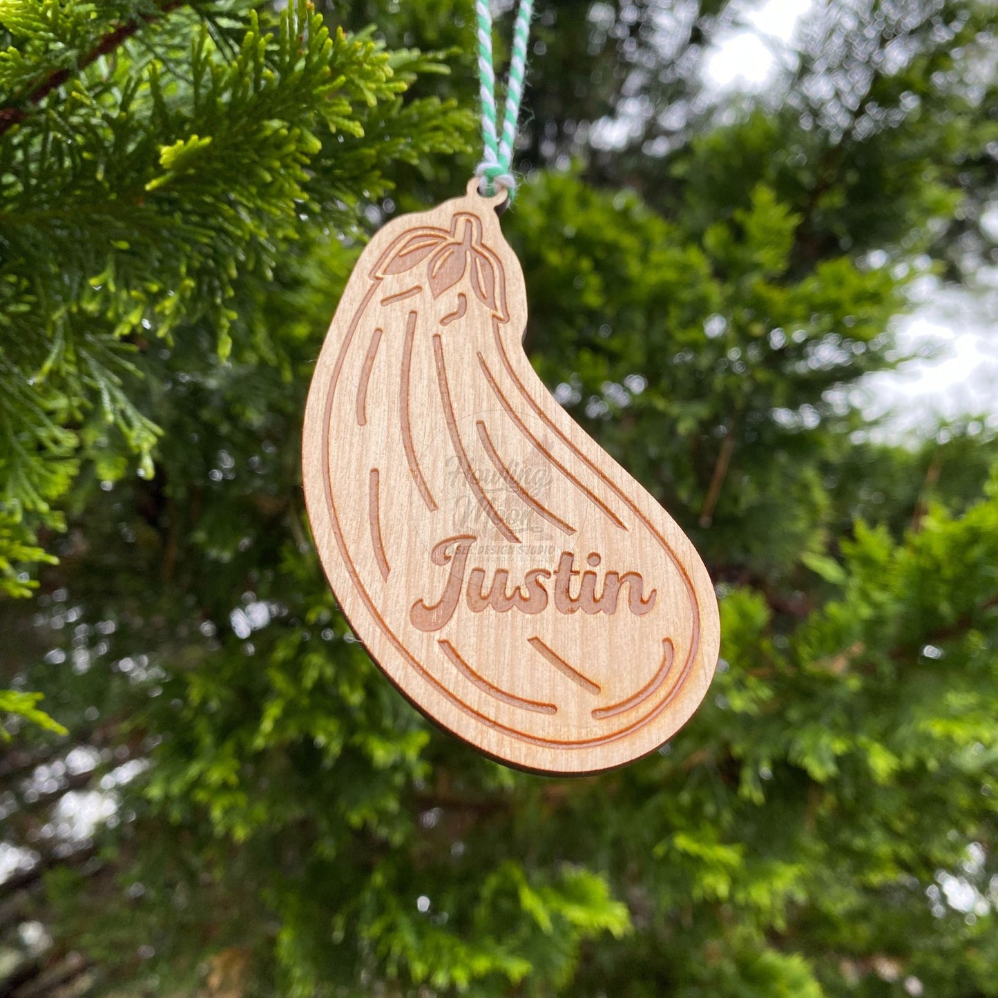 Close up view of Personalized eggplant ornament from Howling Moon Laser Design Studio in Virginia USA