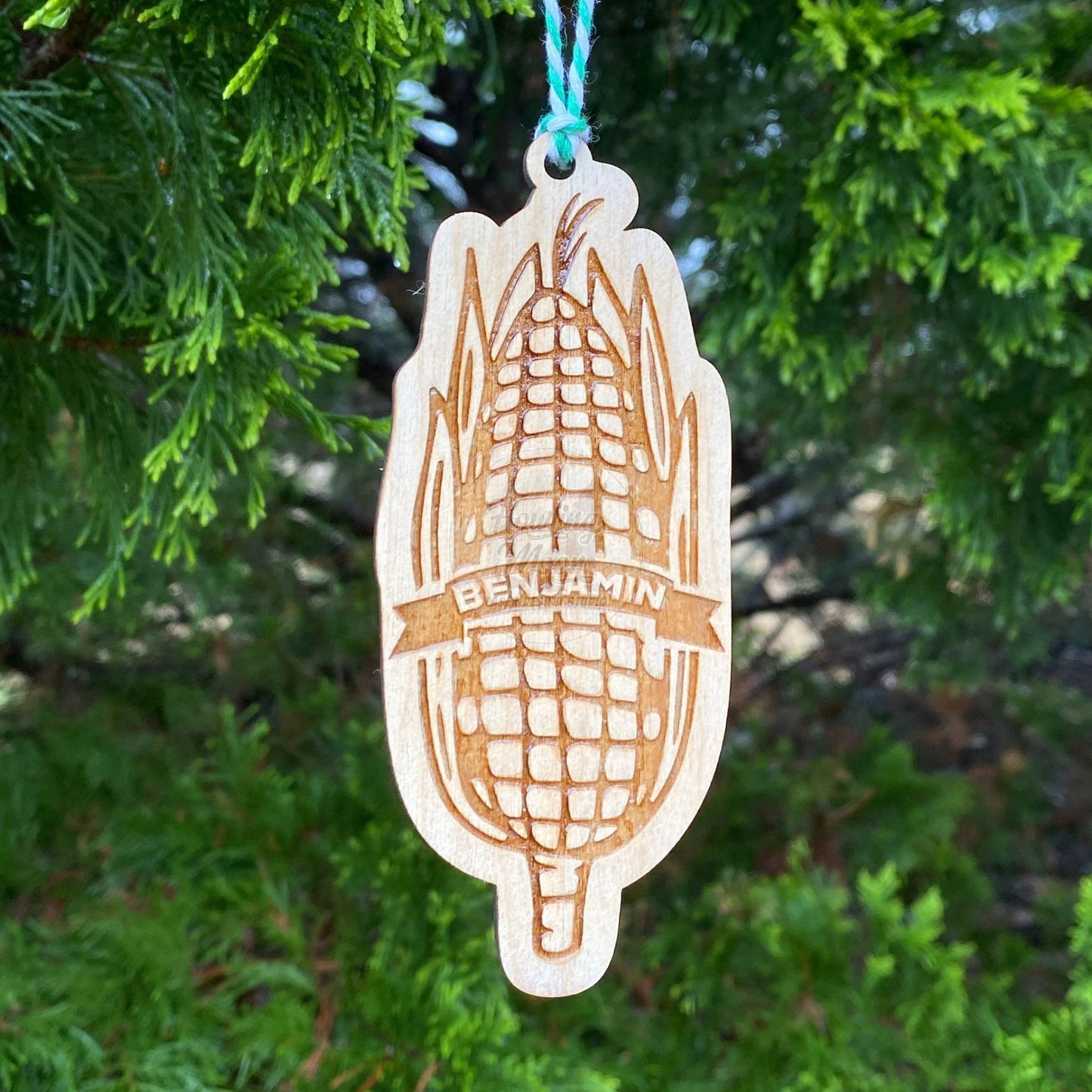 Personalized Sweet Corn Ornament from Howling Moon Laser Design features hand drawn ear of corn and twine ribbon for hanging